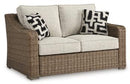 Beachcroft Outdoor Loveseat with Cushion - Furniture Now (CA)